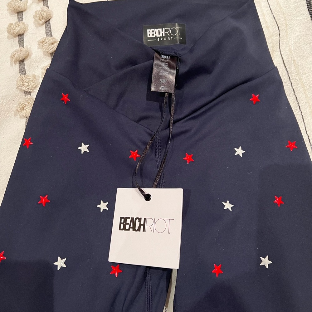 Beachriot navy leggings with red and white stars.